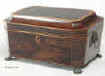 An octagonal shaped Regency rosewood box with   embossed gilt brass drop handles and standing on lion feet Circa 1815