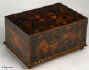 A box in various woods cut as very thick veneers. The woods are juxtaposed in an unusual pattern, which combines angular geometric shapes with hearts and a central  stylized flower. Origin: English. Circa: 1780 Enlarge Picture