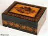 A rosewood veneered Tunbridge ware box by T Barton, the slightly domed top inlayed with a display of roses depicted in micro mosaic,  framed by bandings of contrasting light and dark wood and particularly well matched geometric micro mosaic; there is a further banding of Berlin wool work Design encircling the box. The inside is lined with its original red paper circa 1850 Enlarge Picture