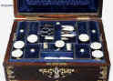  SB120: A fully fitted sewing box veneered in thick striated coromandel  and inlaid in brass and shell, both mother of pearl and abalone. Inside there is the original fitted liftout tray  lined with silk and velvet, with a set (6)  of carved and turned mother of pearl daisy pattern spools designed for the new thread which now came on wooden reels.  The tray also has supplementary lids with carved mother of pearl pulls.   The box also has period  sewing tools including penknife button hook, and tweezers, and bodkin with mother of pearl handles. The steel scissors is designed for cutting button holes.  There is a document wallet in the lid. Circa  1870. Enlarge Picture